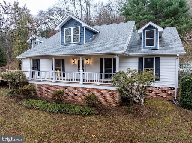 view of front of house featuring a porch and roof with shingles