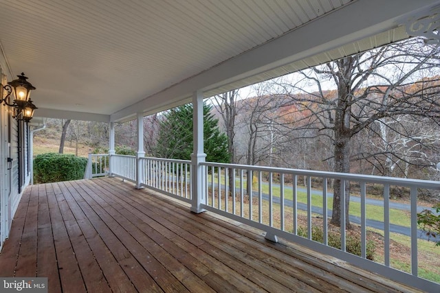 wooden deck featuring a mountain view