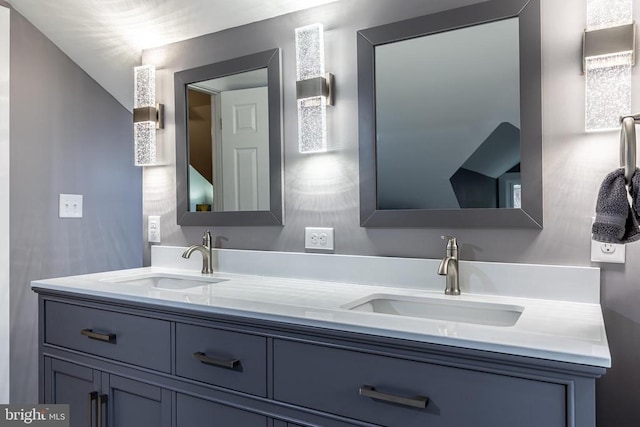 bathroom with double vanity and a sink