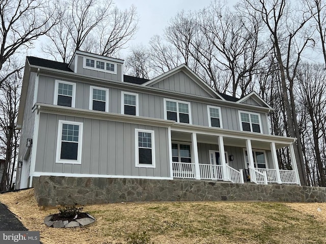 view of front of home featuring board and batten siding and covered porch