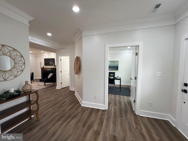 hall with visible vents, dark wood-style floors, recessed lighting, crown molding, and baseboards