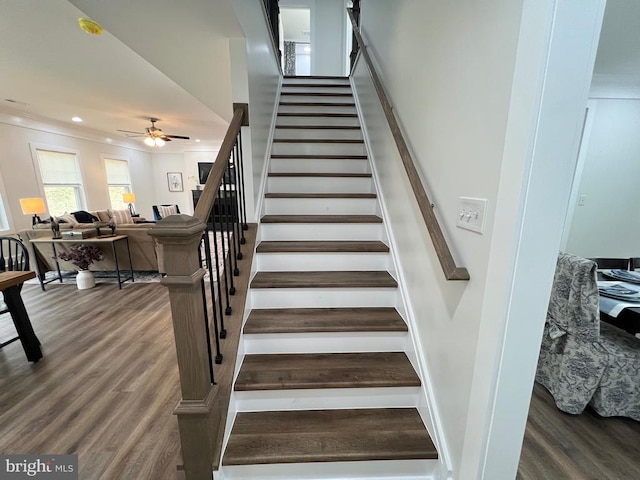 stairway featuring wood finished floors, recessed lighting, and a ceiling fan