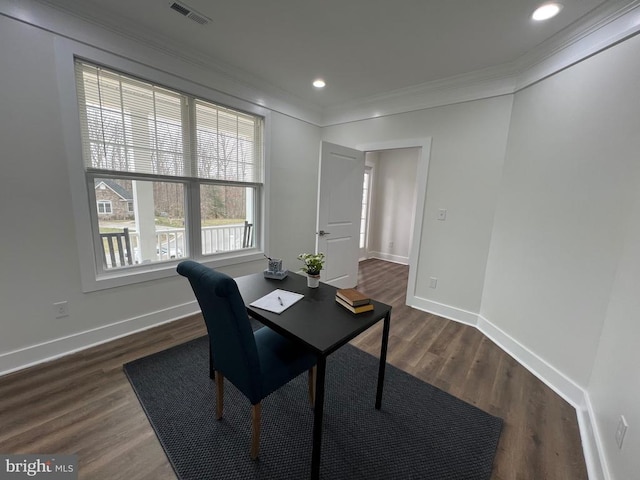 office space featuring visible vents, baseboards, dark wood-style flooring, and crown molding