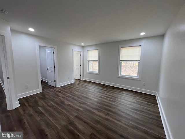 unfurnished bedroom with recessed lighting, baseboards, and dark wood-style flooring