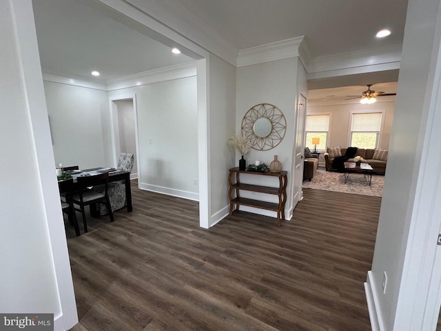 corridor featuring crown molding, recessed lighting, dark wood-style floors, and baseboards