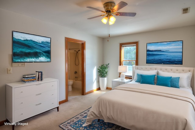 carpeted bedroom featuring ceiling fan and ensuite bathroom