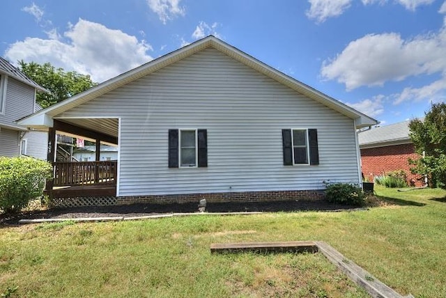 view of property exterior featuring a lawn