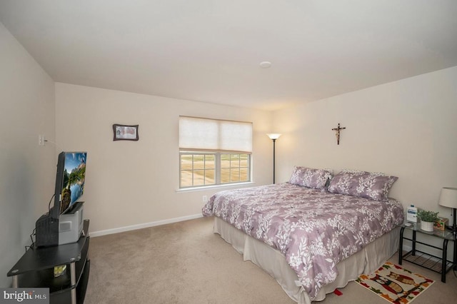 bedroom with baseboards and carpet flooring