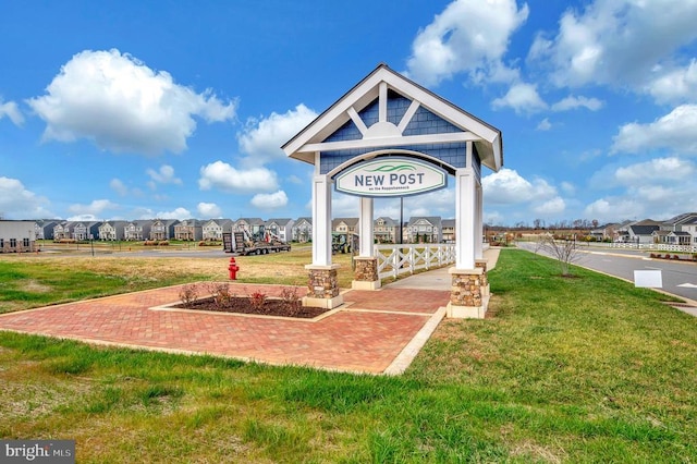 view of home's community featuring a yard and a residential view