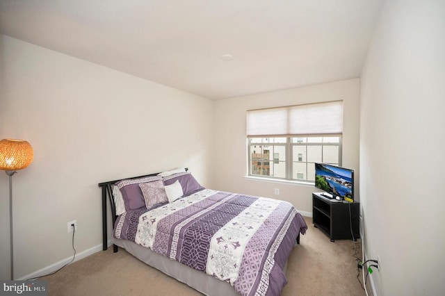 bedroom with carpet flooring and baseboards