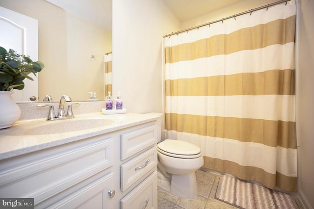 full bath with vanity, toilet, and tile patterned flooring