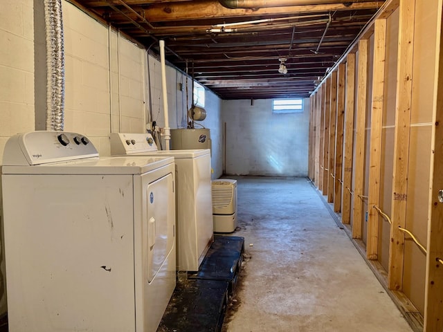 basement with washer and clothes dryer