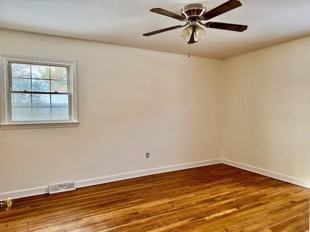 unfurnished room featuring hardwood / wood-style floors and ceiling fan