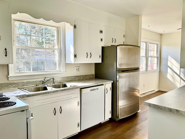 kitchen featuring sink, white cabinetry, baseboard heating, dark hardwood / wood-style floors, and white appliances