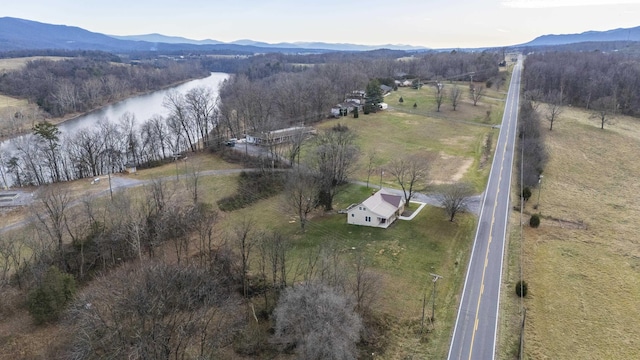 drone / aerial view featuring a rural view and a water and mountain view