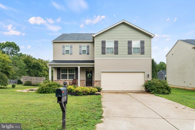 view of front facade featuring a garage, a porch, and a front yard