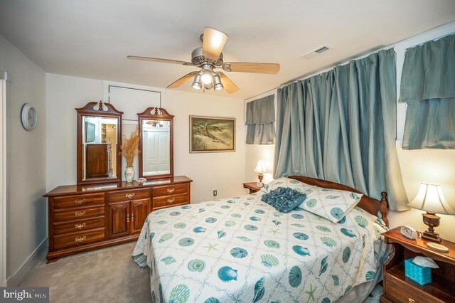 bedroom with ceiling fan and carpet