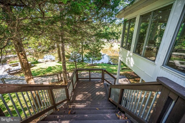 wooden terrace with a water view