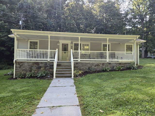 bungalow with a porch and a front lawn