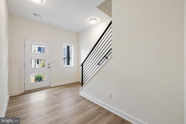 foyer with light wood-type flooring