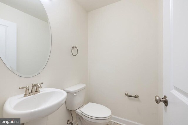 bathroom with sink and toilet