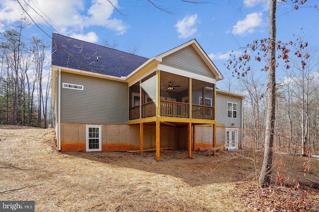 back of house with french doors, ceiling fan, and a sunroom