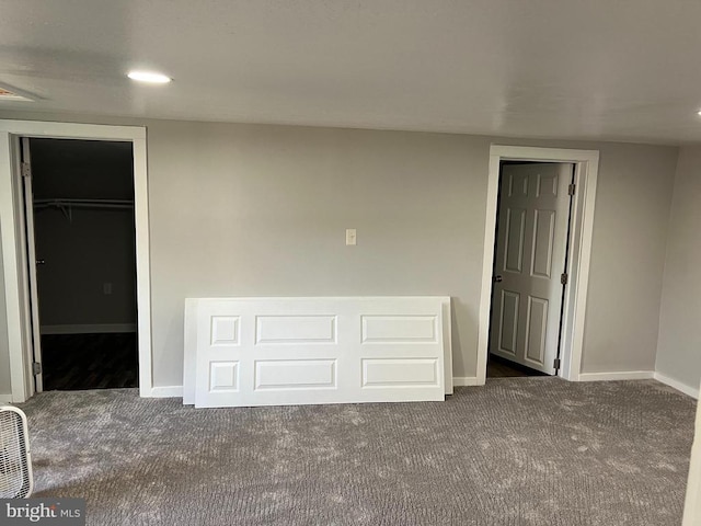 empty room with dark carpet