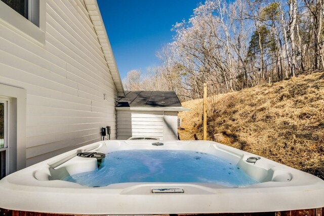 exterior space with area for grilling and a hot tub