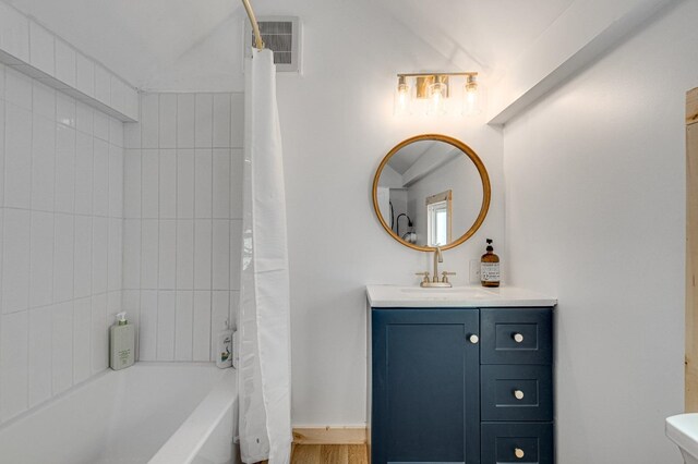 bathroom with vanity and shower / bath combo with shower curtain