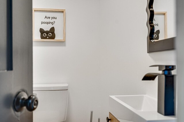 bathroom featuring sink and toilet