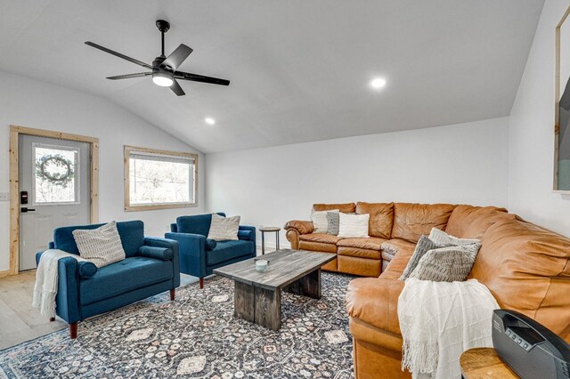 living room with lofted ceiling and ceiling fan