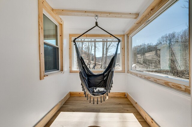 sunroom with beamed ceiling