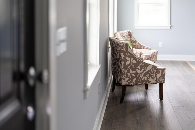 sitting room featuring wood finished floors and baseboards