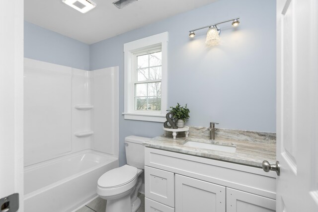 bathroom featuring toilet, visible vents, tub / shower combination, and vanity