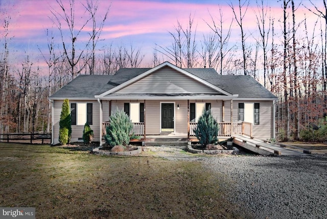 view of front facade with a yard and a porch