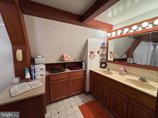 full bath featuring tile patterned floors, double vanity, and a sink