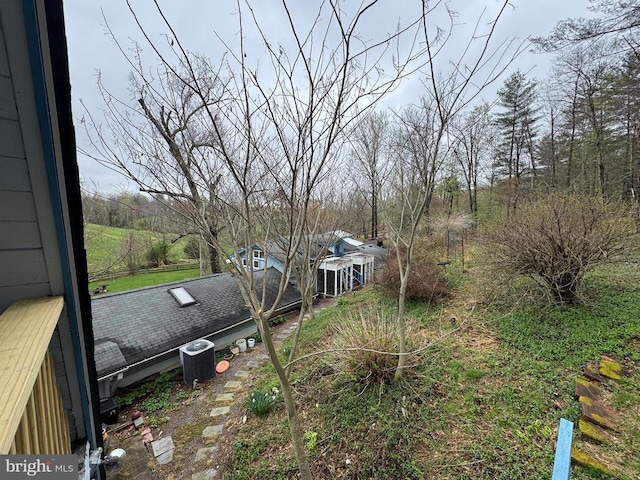 view of yard with central AC