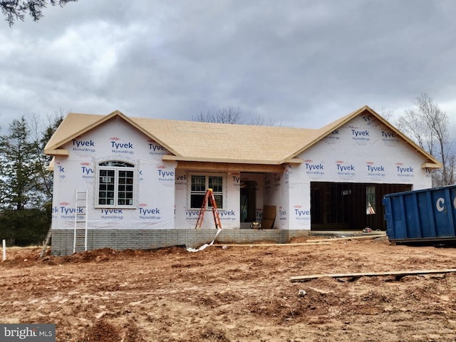 property in mid-construction featuring a garage