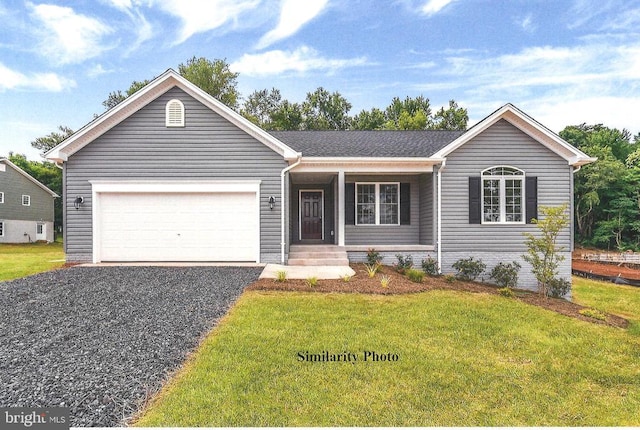 ranch-style house featuring a front lawn, gravel driveway, and an attached garage