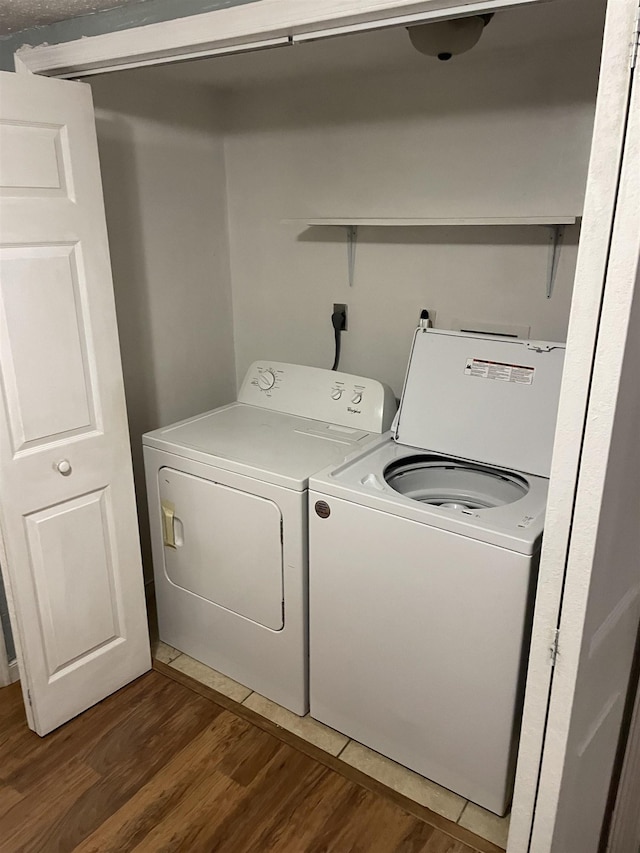 laundry area featuring independent washer and dryer and dark hardwood / wood-style floors