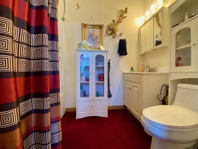 full bathroom with vanity, toilet, and shower / tub combo with curtain