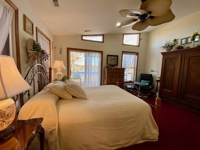 bedroom featuring lofted ceiling and ceiling fan