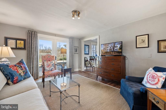 living area with wood finished floors and baseboards