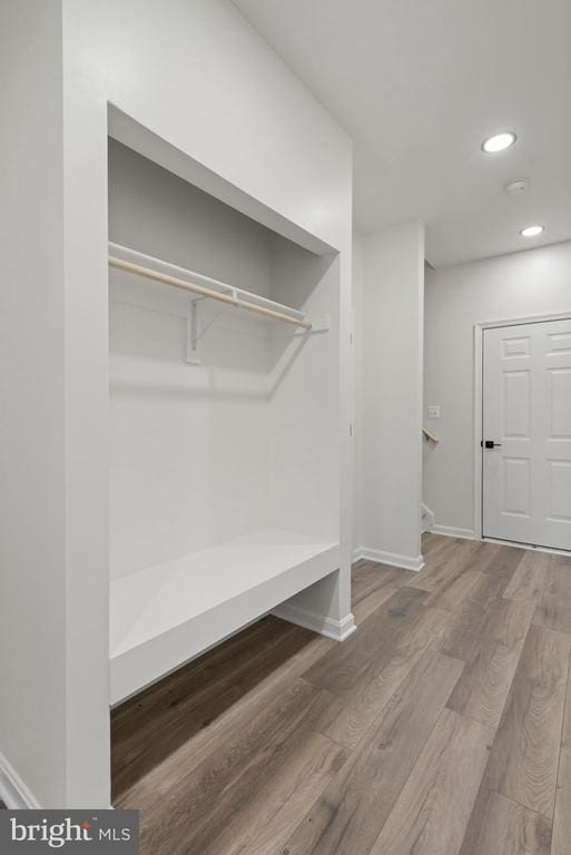 mudroom featuring recessed lighting, wood finished floors, and baseboards