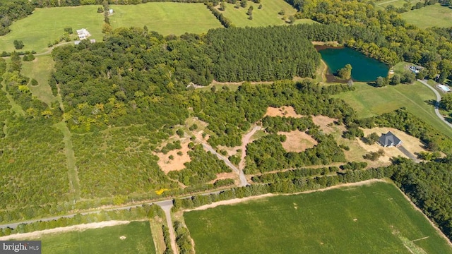 bird's eye view with a rural view and a water view