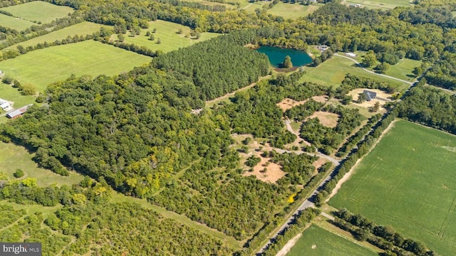 birds eye view of property with a water view and a rural view