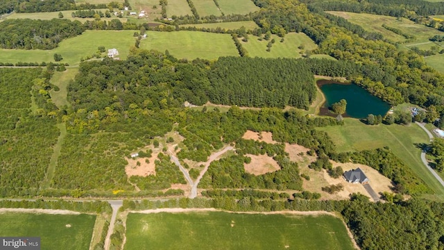 aerial view with a water view and a rural view