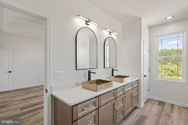 bathroom featuring vanity and hardwood / wood-style floors