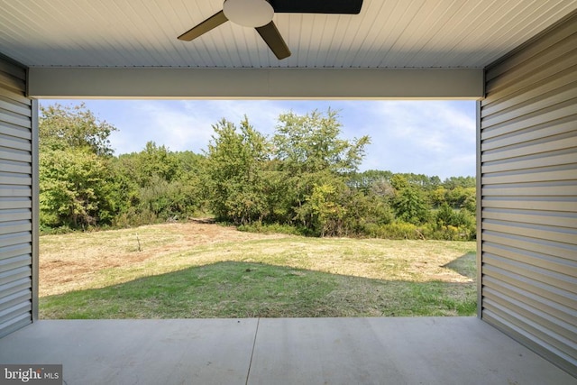 view of yard featuring ceiling fan