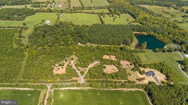 aerial view featuring a rural view and a water view